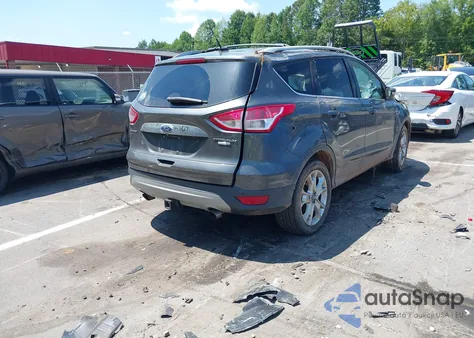 2016 Ford Escape Titanium z USA, uszkodzony, nr VIN 1FMCU9J95GUB57721